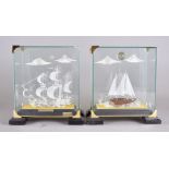 Two 'Glass and Gold' cased ships, a galleon and ketch, 25.5 cm high (one af)