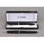 A pair of Parker fountain pens, black, gilt band and clip, one box