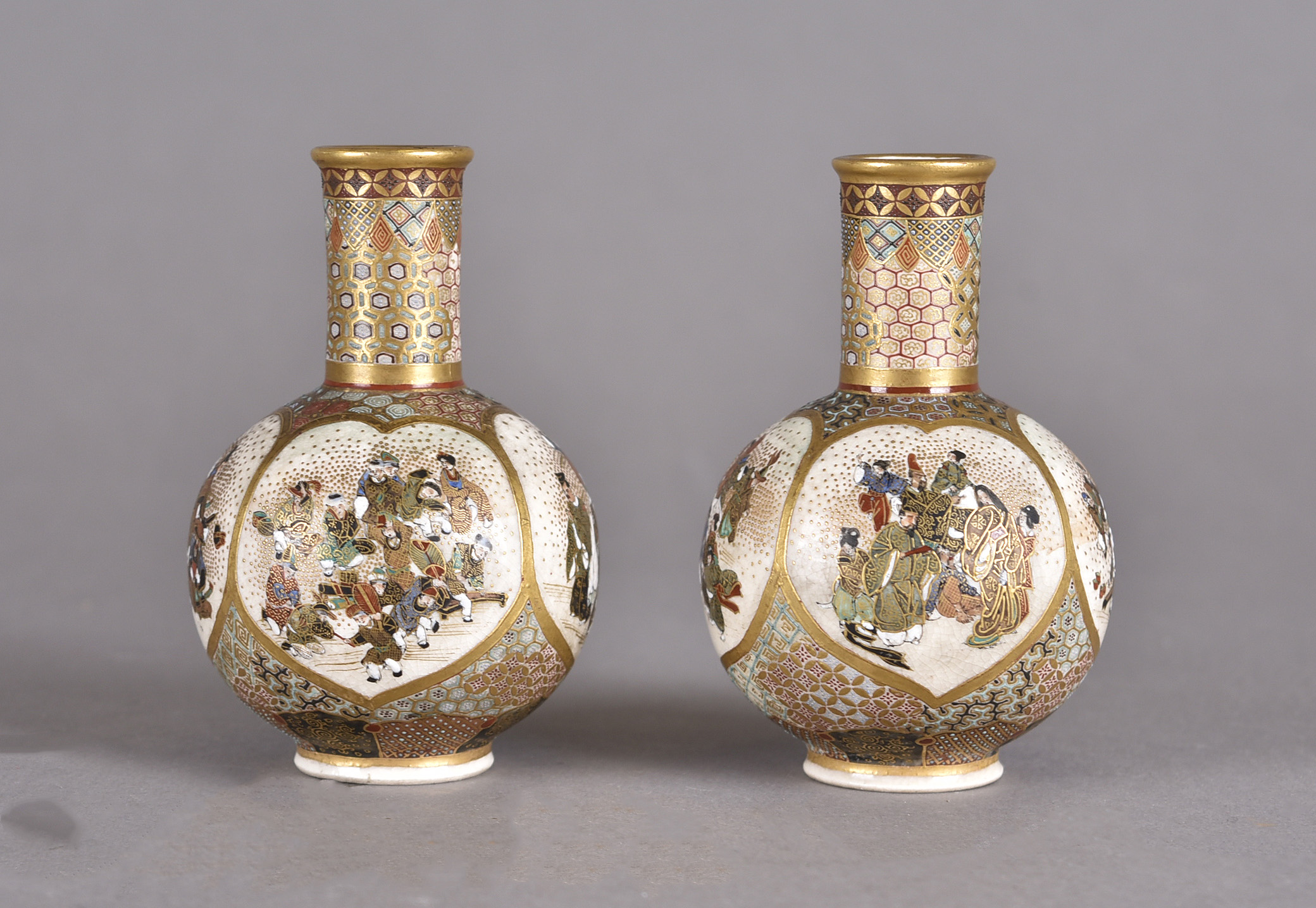 A pair of Satsuma miniature bottle vases possibly by Kinzangama, each with four panels decorated