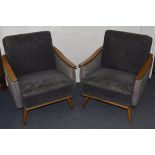 A pair of Scandinavian beech and upholstered easy chairs c. 1954, varnished arms with solid grey