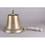 A large brass ship's bell, rope ringer, hook suspension, 24 cm diameter