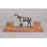 An Art Deco Bakelite and silver plated ink stand, modelled as a horse and rider, 26.5 cm wide