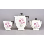 An Art Deco three piece Limoges coffee service, comprising coffee pot, milk jug and twin-handled