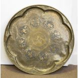 A 19th Century Persian large brass circular tray, the well of octofoil form with central medallion