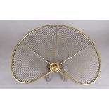 A brass and mesh fire guard, 61 cm wide