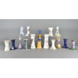 A large collection of Victorian and Edwardian pottery and porcelain hatpin holders, including Art