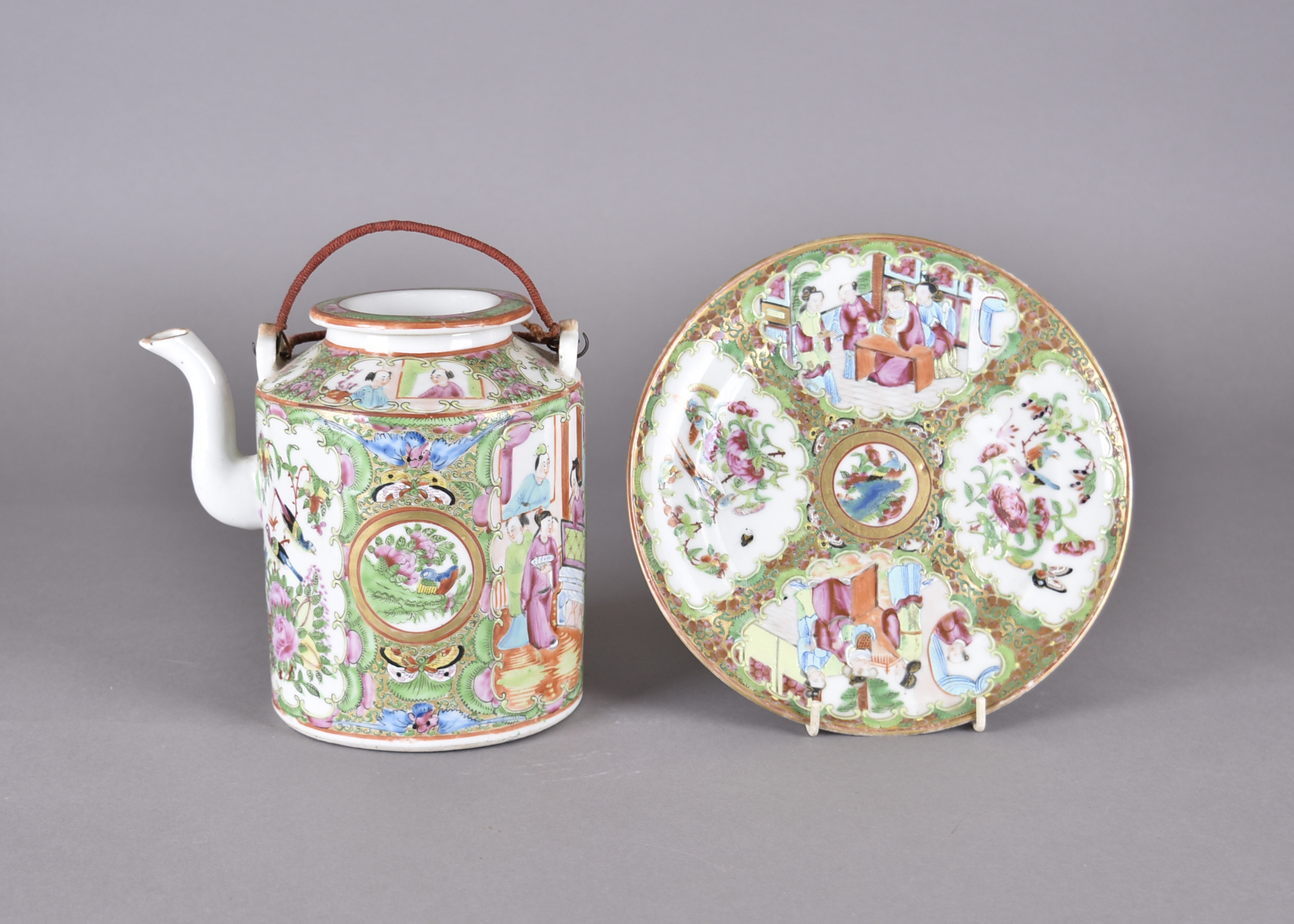 A 19th Century Chinese Canton decorated tea pot, heightened in gilt, and a matching plate, both