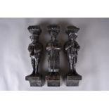 A set of four carved oak corbels, modelled as musicians, all on carved bracket supports, 36 cm,