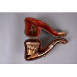 A 19th Century carved meerschaum and amber pipe, bowl carved with the face of young woman in bonnet,