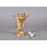 A Royal Worcester pot pourri, modelled as eagle with wings outstretched supporting a pierced egg,