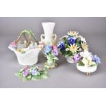 A collection of Royal Crown Staffordshire floral displays, comprising a basket, a three footed bowl,