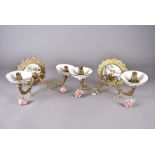 A set of three Continental pottery and gilt metal wall lights, laurel decoration