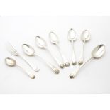 A set of six George III silver dessert spoons, old English with shell, having engraved family crest,