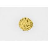 An ancient Middle Eastern gold hammered dinar, with Arabic script, F, 4.2g