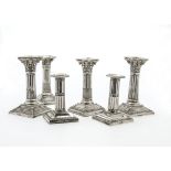 Three pairs of Victorian and later silver filled column candlesticks, two Corinthian form, and one