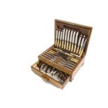 A canteen of Art Deco period silver plated cutlery, in wooden case, together with a circular