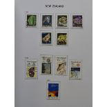 A collection of stamps from New Zealand and Australia, presented in Davo Albums and both volumes