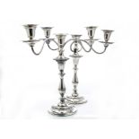 A pair of modern Sheffield plate candelabra by Hecworth, circular column supports with twin branch