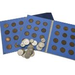 A collection of British coins, including several George V silver coinage, two half penny folders,