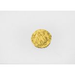 An ancient Middle Eastern gold hammered dinar, with Arabic script, F, 4g