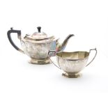 An Art Deco period silver tea pot and milk jug from the Northern Goldsmith Co, octagonal on