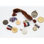 A collection of Georgian and later coins and other items, most coins in plastic pockets with