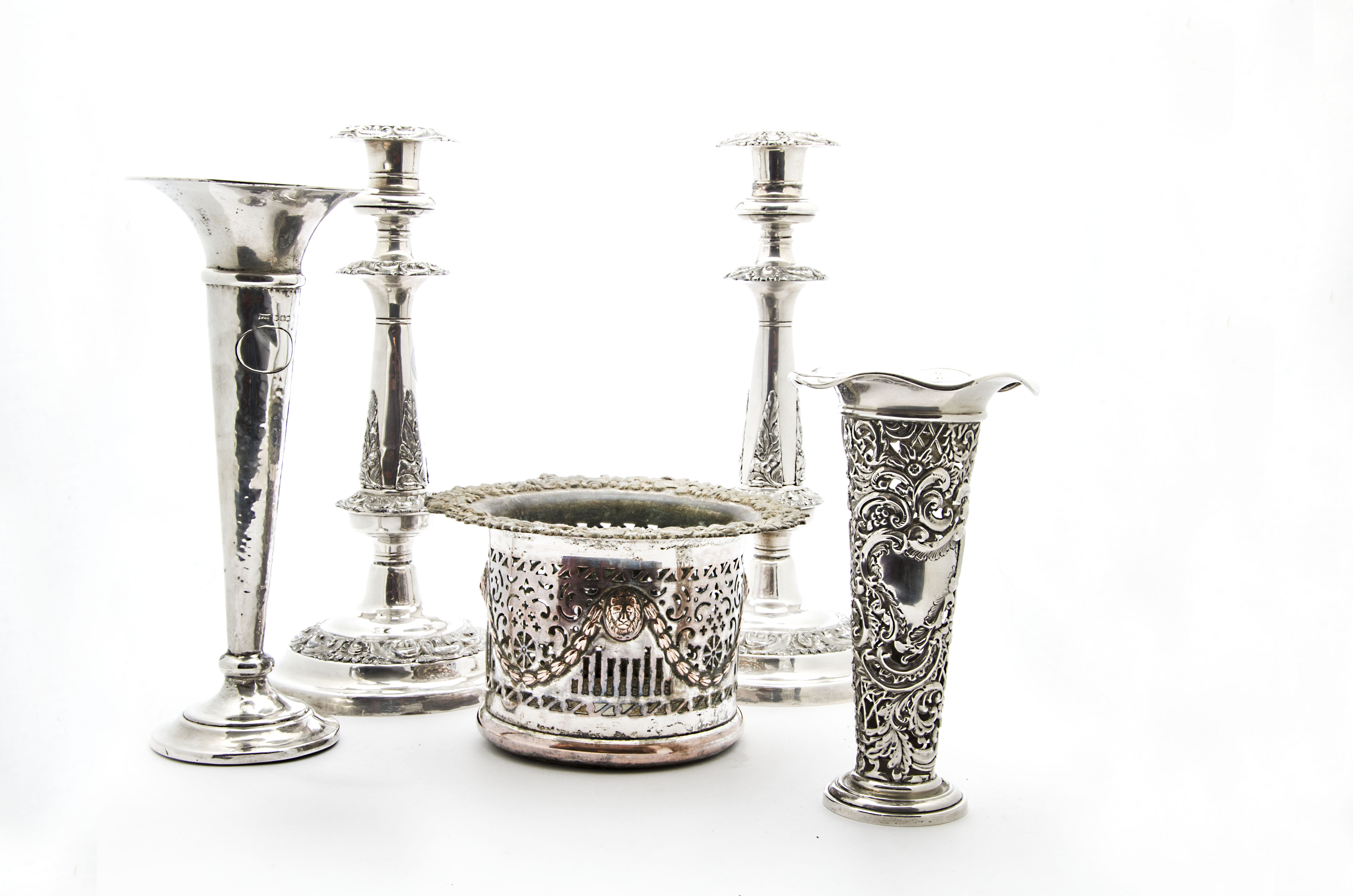 A late Victorian silver pierced and filled trumpet vase, together with another silver filled trumpet