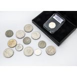 A collection of coins and stamps, including 18 Royal Mail Mint sets, a Royal Canadian Mint silver