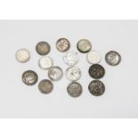 A collection of fifteen Maundy three pence coins, with dates including 1670, 1689, 1698, 1737, three