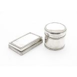 An Edwardian silver table snuff box and tobacco pot from Drew & Sons, rectangular box with egg and