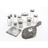 A group of eight Victorian and later cut glass and silver mounted dressing table bottles and pots,