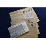 A collection of British stamps, including empty albums for Charles & Diana and the stamps in packets