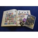 A collection of stamps and coins and other items, including a 1940s Strand album, a similar