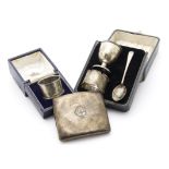 A cased George V silver three piece Christening gift set, together with a cased silver napkin ring
