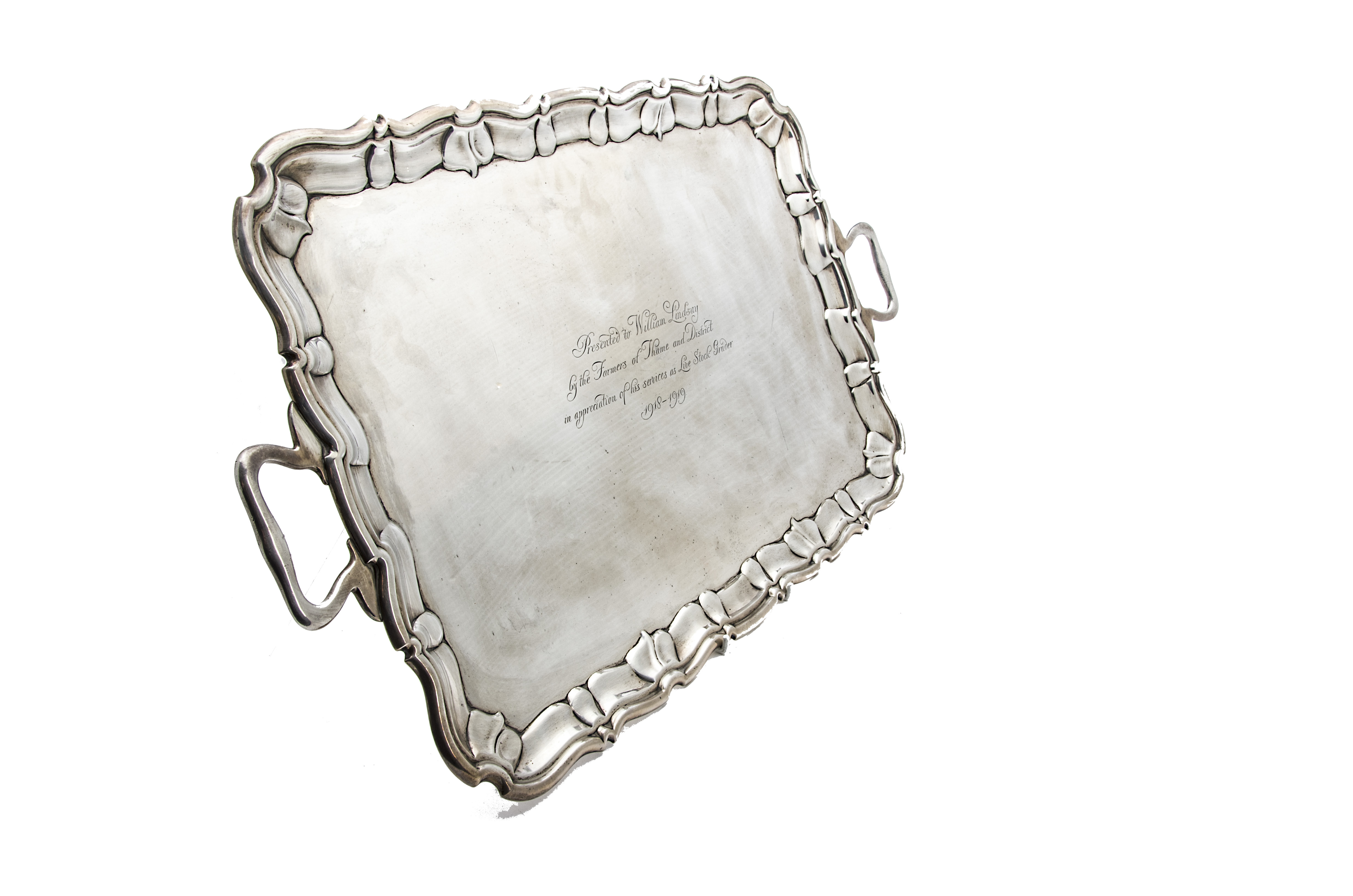 A George V period large silver twin handled tray by Henry Wilkinson & Co, rectangular with shaped