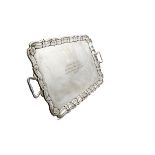 A George V period large silver twin handled tray by Henry Wilkinson & Co, rectangular with shaped