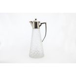 An Edwardian glass and silver mounted claret jug by William Hutton & Sons, having diamond pattern