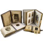 Four musical photograph albums, one of Carte-de-visite size with movement playing two airs, the