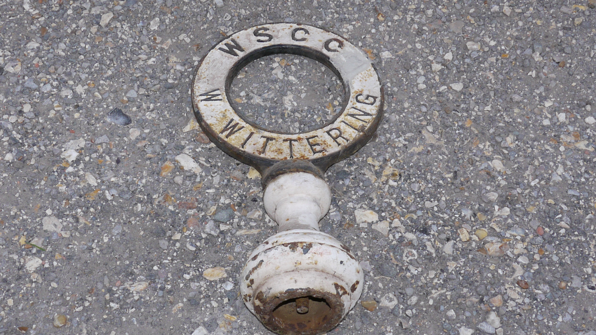 West Wittering Sign, An original double sided cast iron ring form post top signs with iron socle,