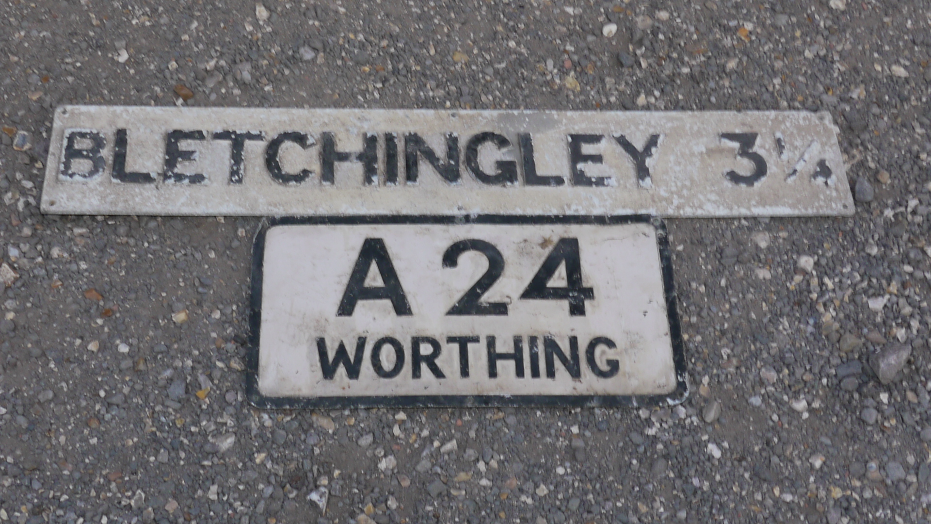 Bletchingley and Worthing Signs, A duo of original alloy post mounted signs, black on white one