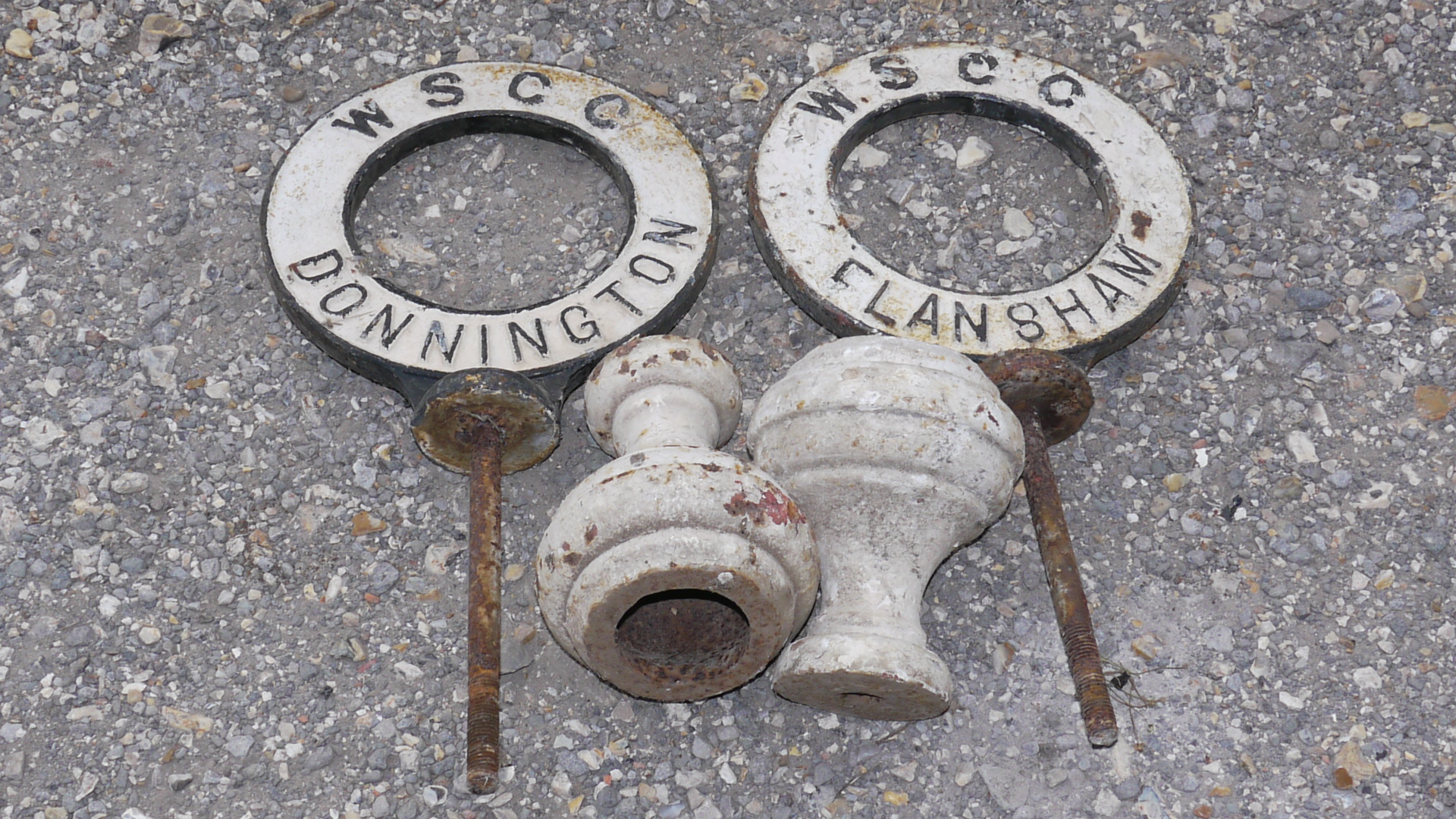 Flansham and Donnington Signs, A duo of original double sided cast iron ring form post top signs