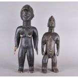 A Chamba Male figure and a Mende female figure, 48cm and 58cm high (2)