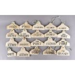 A collection of 1920s pottery cellar labels for Whisky, Sherry, Port, Claret, Brandy, Madeira,