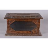 A late 19th Century rosewood country house letter box, having carved floral surround with glazed