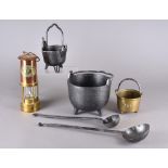 Various industrial metalware including two iron cauldrons, a three footed brass railway cauldron