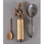 An Indonesian type horn spoon and an Indonesian bamboo container with a horse and rider lid,