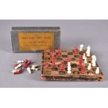 A travelling chess board with chess men by W H Smith & Sons, the fold out leather board with blue