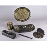 A collection of papier mache items including an oval gilt decorated tray, a mother-of-pearl inlaid