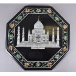 An octagonal pietra dura inlaid panel centred with a mother of pearl Indian temple, possibly the Taj