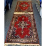 A pair of modern Persian style woolen rugs, pole medallion on red field, indigo spandrels, ivory